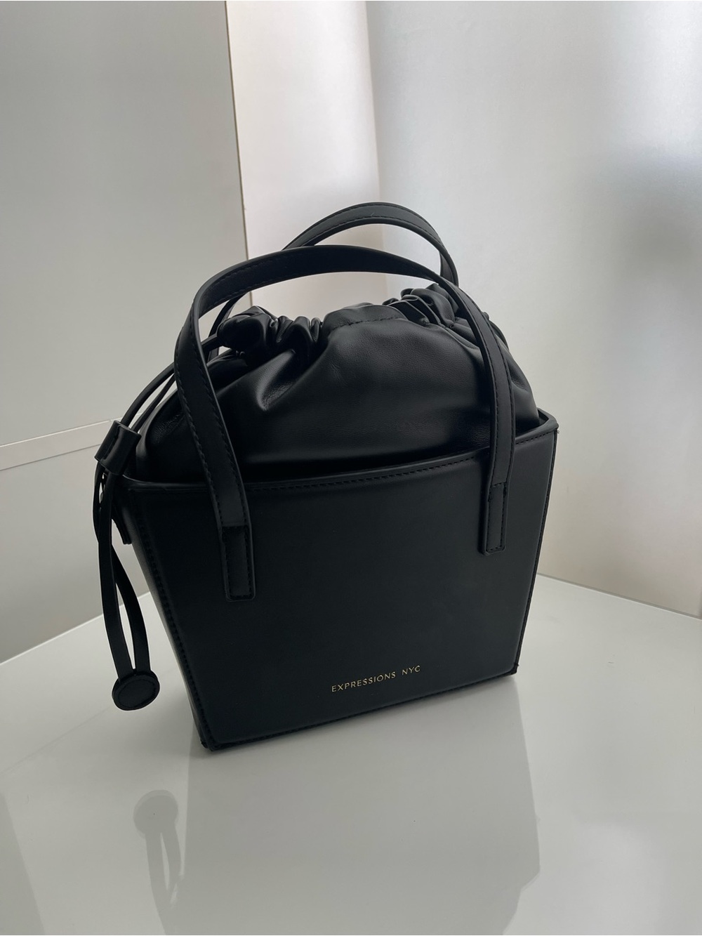 Expressions Black Leather Drawstring Bucket Tote